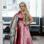 suzanne rogers with long curly side swept hairstyle