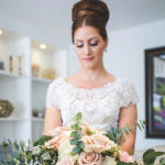 bridal hairstyle updo with floral bouquet
