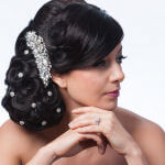 bridal hairstyle chignon with curls and crystal pins