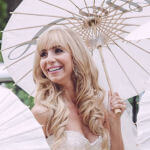 bridal hairstyle blond with long loose curls and bangs